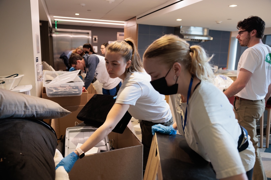 Students packing boxes as part of green move out