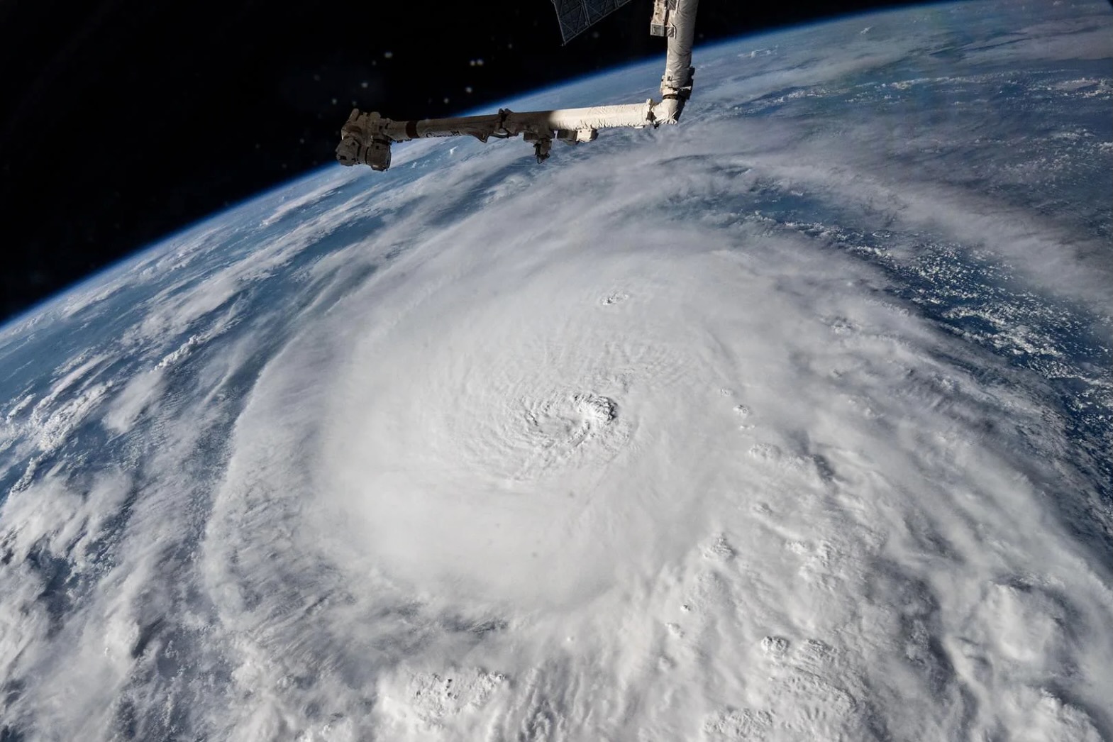 Aerial view of earth with clouds and a sateltie 