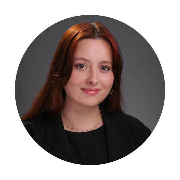 a woman with long brown hair in a black shirt