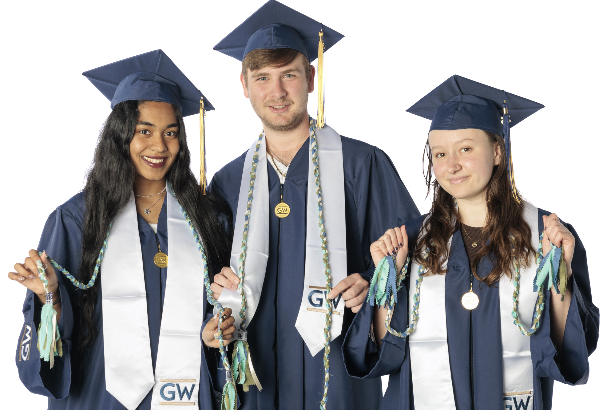 Three GW Students in graduation regalia with Sustainability Minor graduation cords