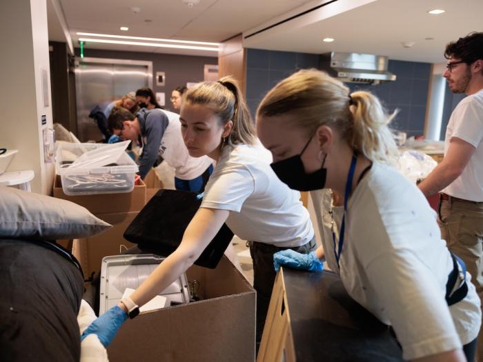 Students packing boxes as part of green move out