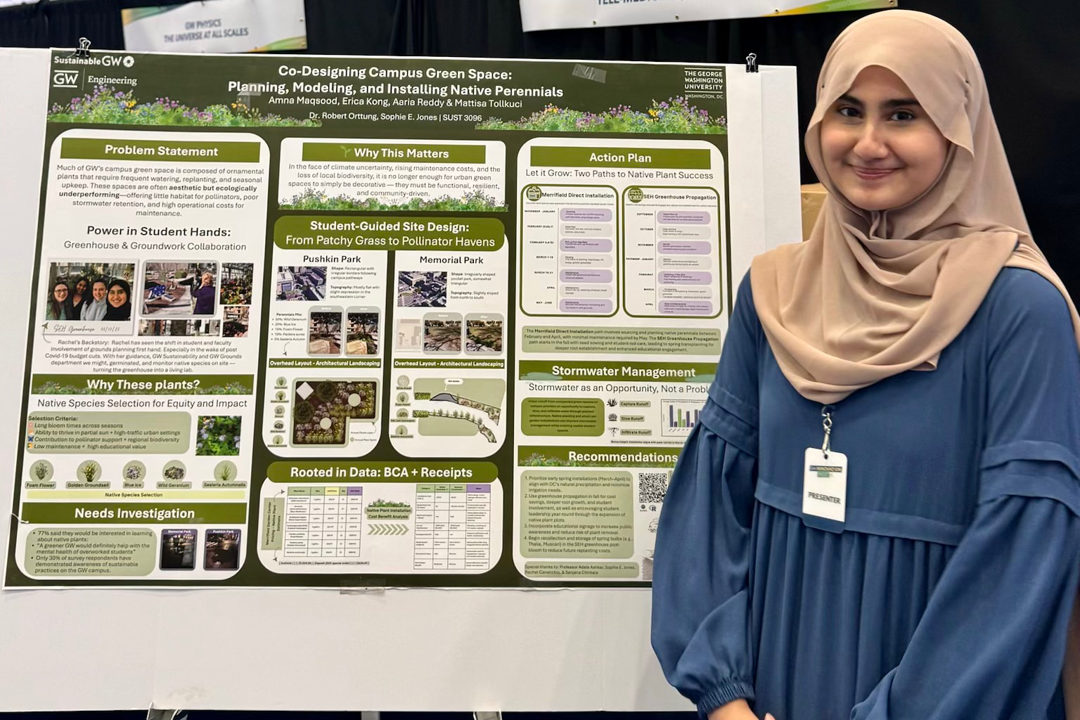 a student in a blue shirt stands in front of a green science poster