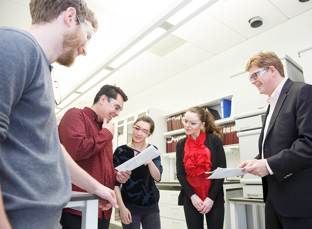 researchers collaborate in a lab