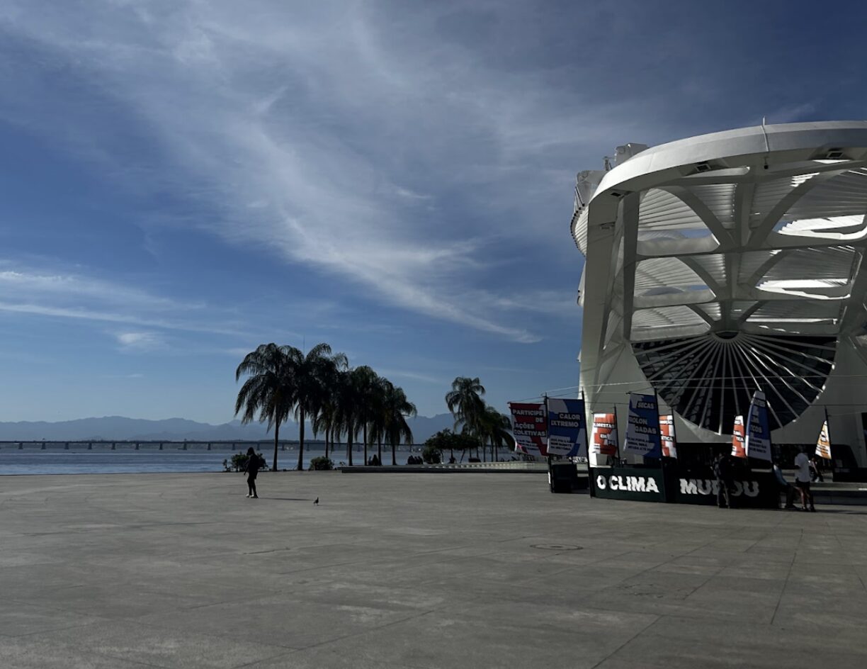 a light blue sky and palm trees