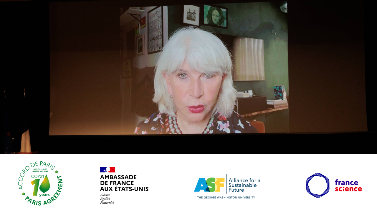 a woman with white hair on a screen 